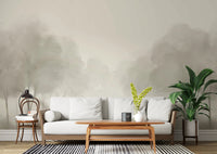Whispering Blooms Wall Mural with soft grey tree landscape in living room.