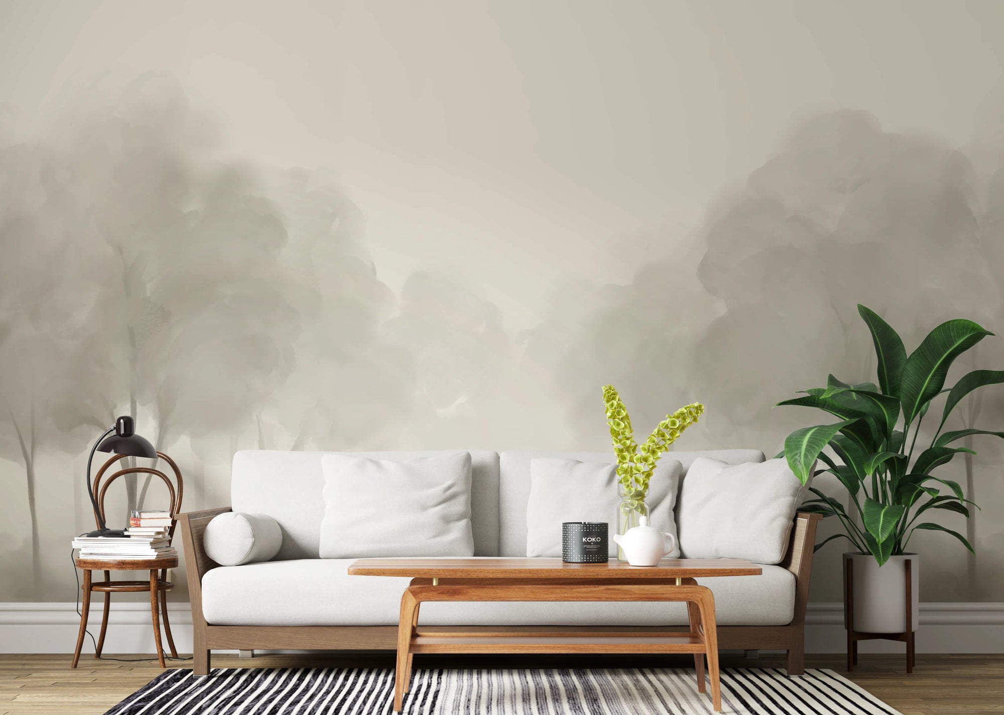 Whispering Blooms Wall Mural with soft grey tree landscape in living room.
