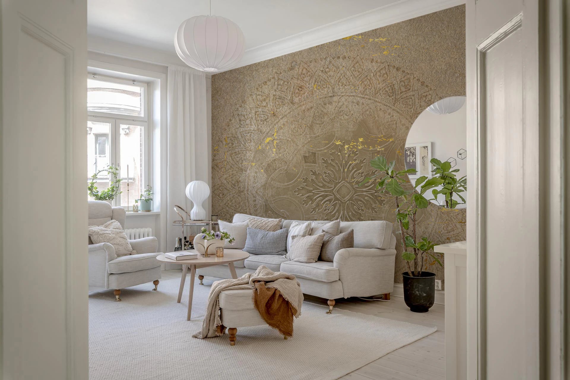 Gilded mandala tapestry mural with beige tone in living room.