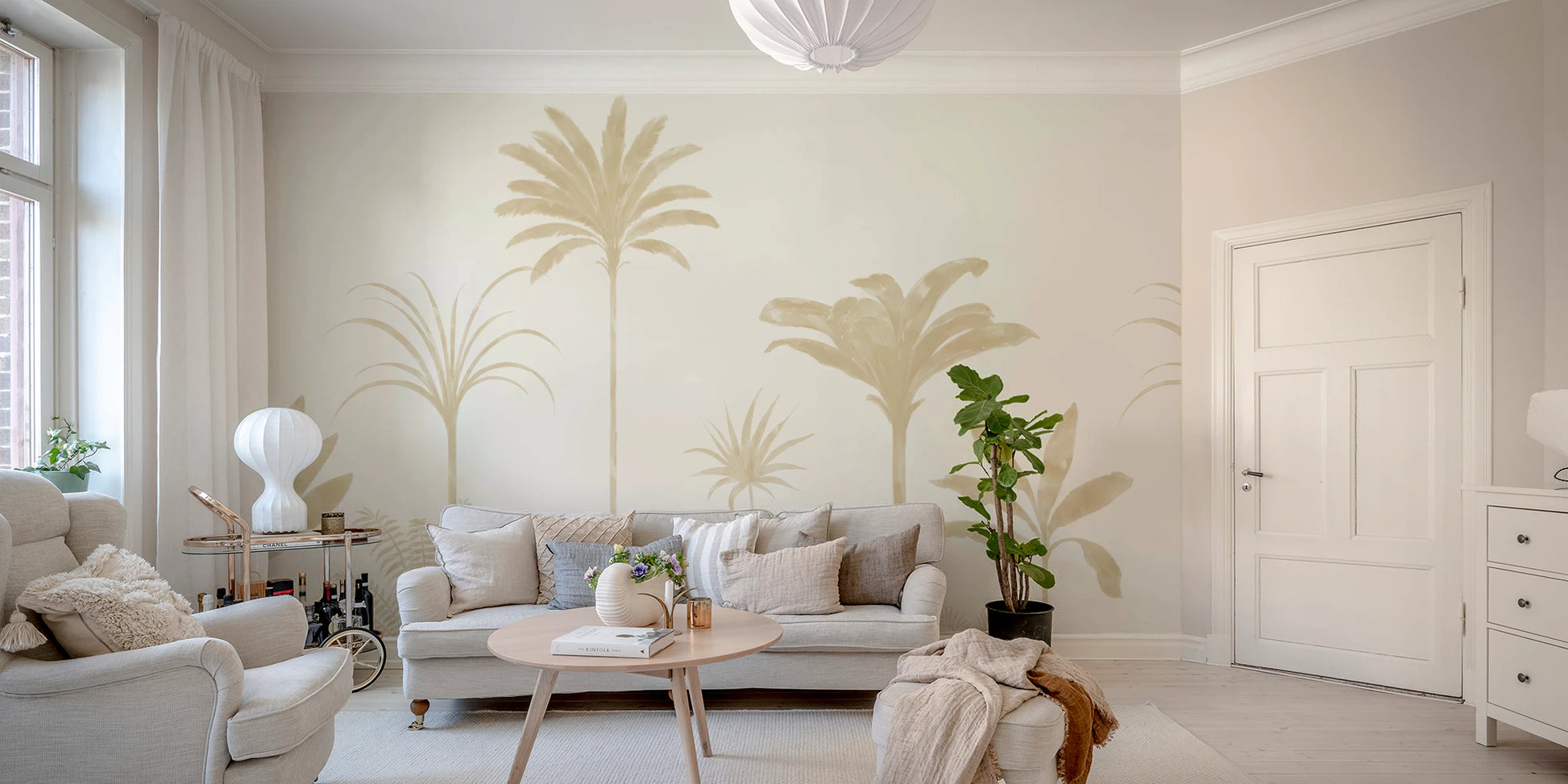 Tropical mural with painterly palm fronds in muted beige tones.