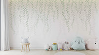 Minimalist vine wall mural with small oval leaves in muted greens.
