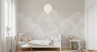 Beige cloud mural in a kids room with calm pastel atmosphere. 