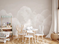 Watercolor cloud mural covering a kids dining area feature wall.