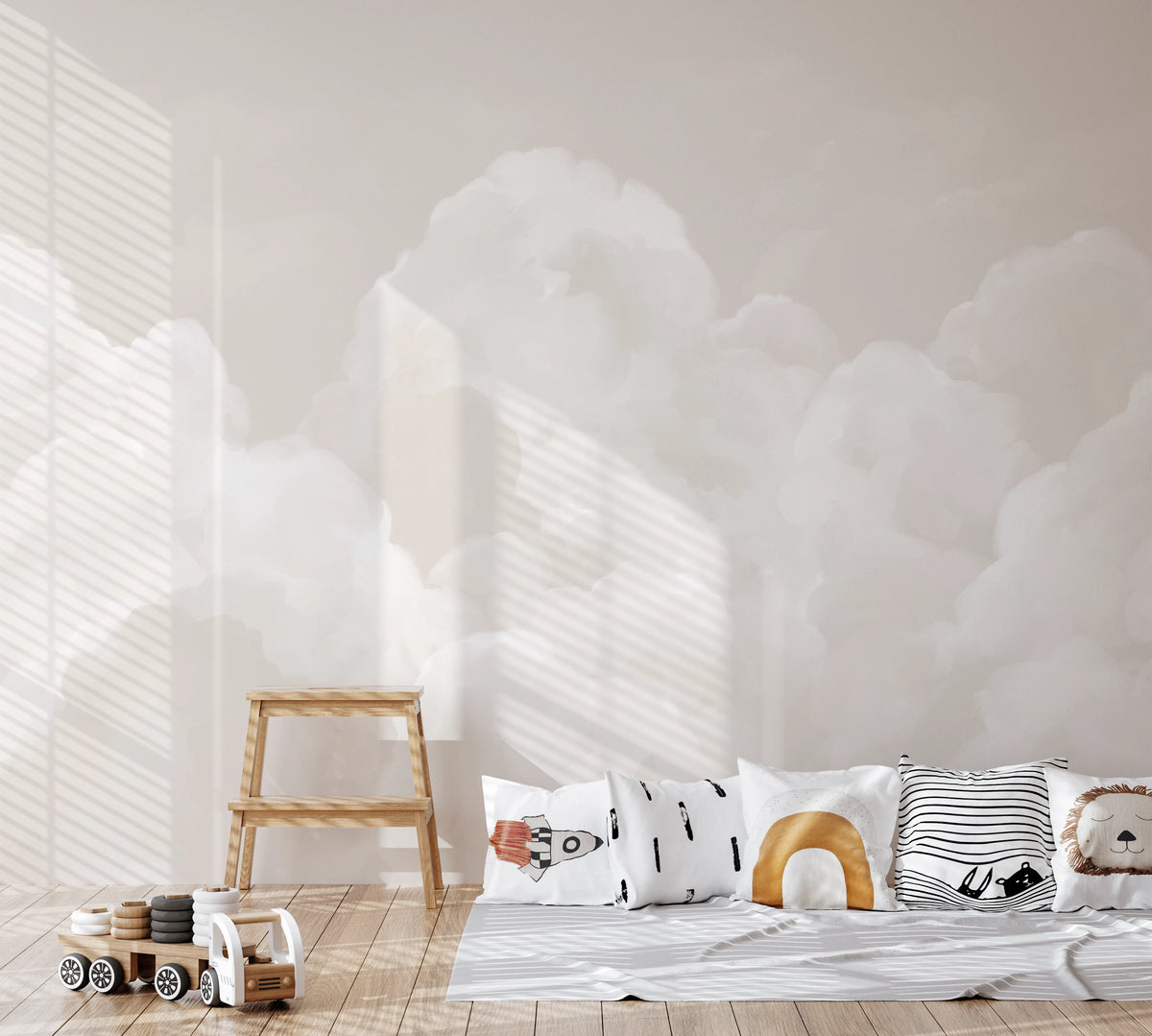 Watercolor cloud wall mural in a nursery with neutral tones. 