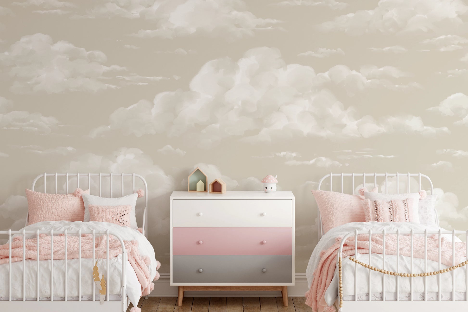 Sky cloud mural on a  twin bedroom wall with warm sand backdrop and soft white painterly clouds.