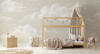 Cloud Whisper sky mural across a toddler room wall in beige with creamy cumulus cloud forms.