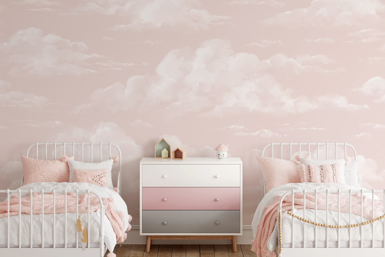 Soft pink cloud wall mural with watercolor cloud finish in kids bedroom.
