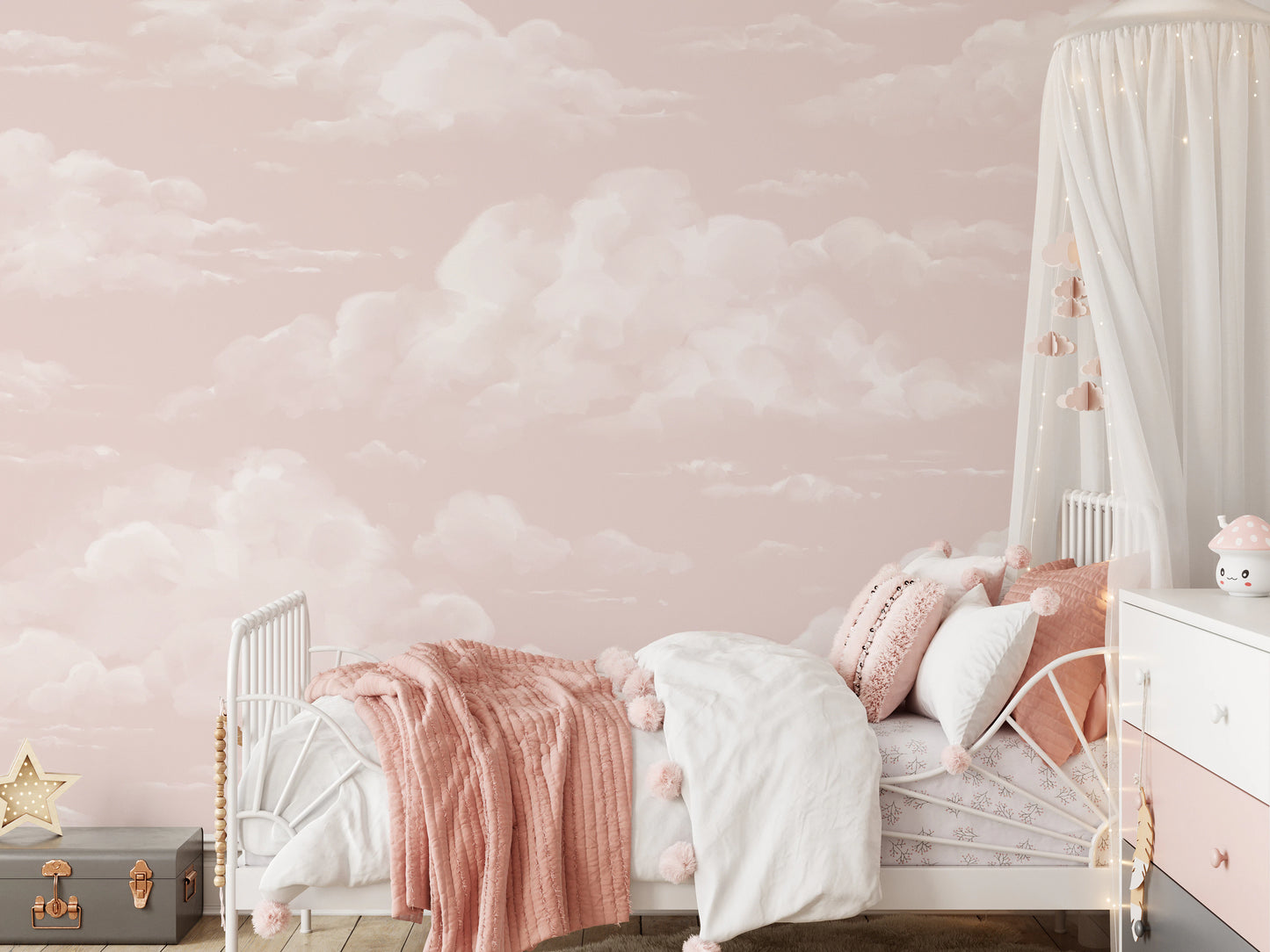 Pastel pink cloud wall mural in child's bedroom with soft white cloud motif. 
