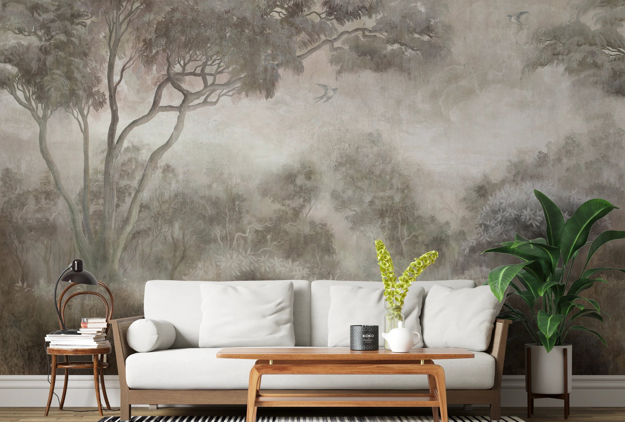 Living room wall mural of misty woodland scene in muted beige tones.