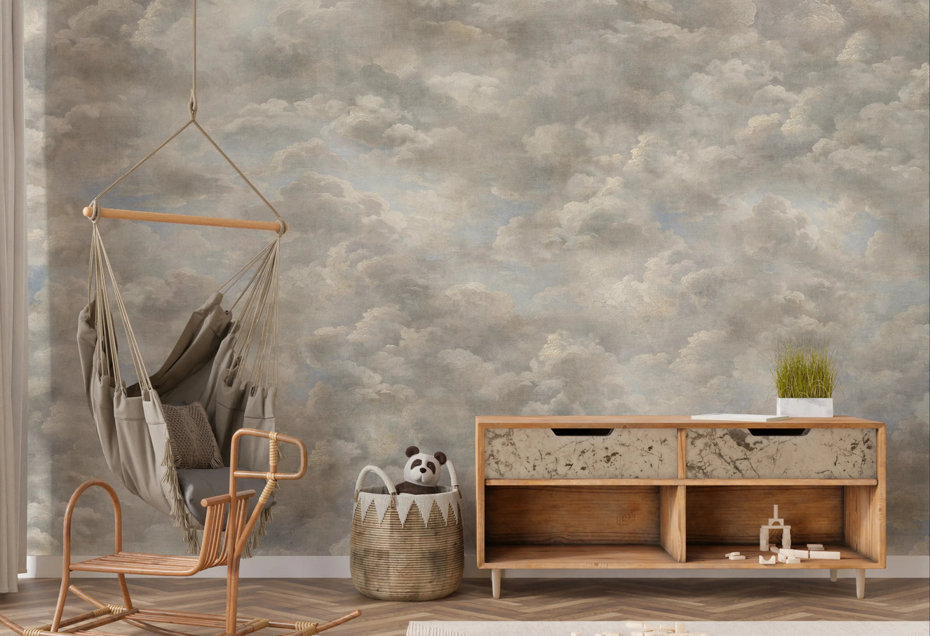 Classical cloud wall mural creating atmosphere in a nursery space.