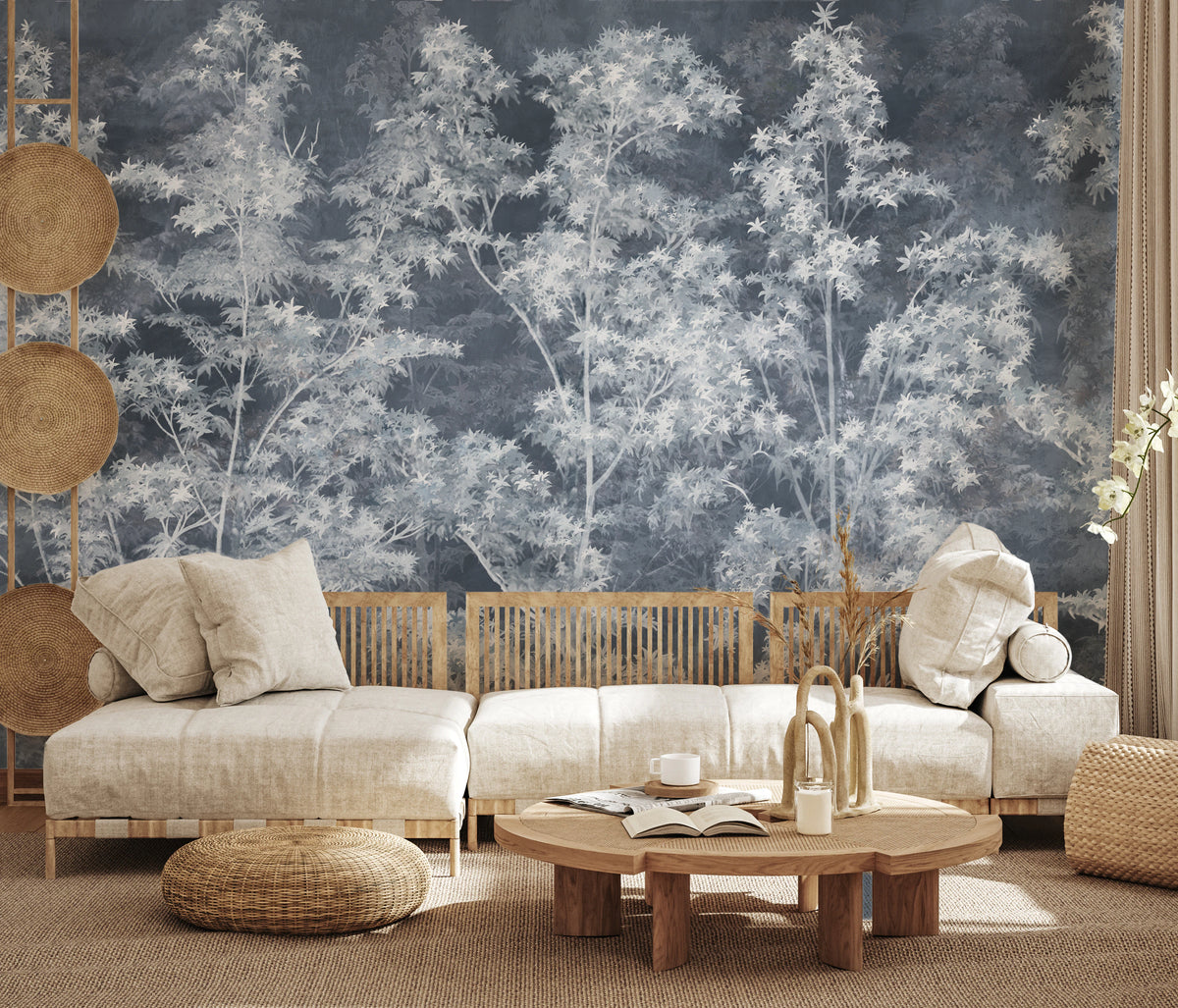 Dense silver tree canopy rendered wall mural in pale tones on slate blue surface.