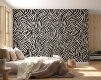 Black and white animal stripe wall mural with tapering fanned lines in bedroom