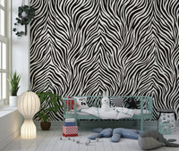 Zebra stripe mural on a children's room feature wall in black and white