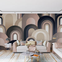 Overlapping dome shapes on mural in warm clay, sand and cream tones on living room wall