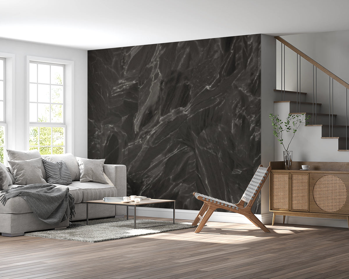 Layered dark stone mural with white veins over black base