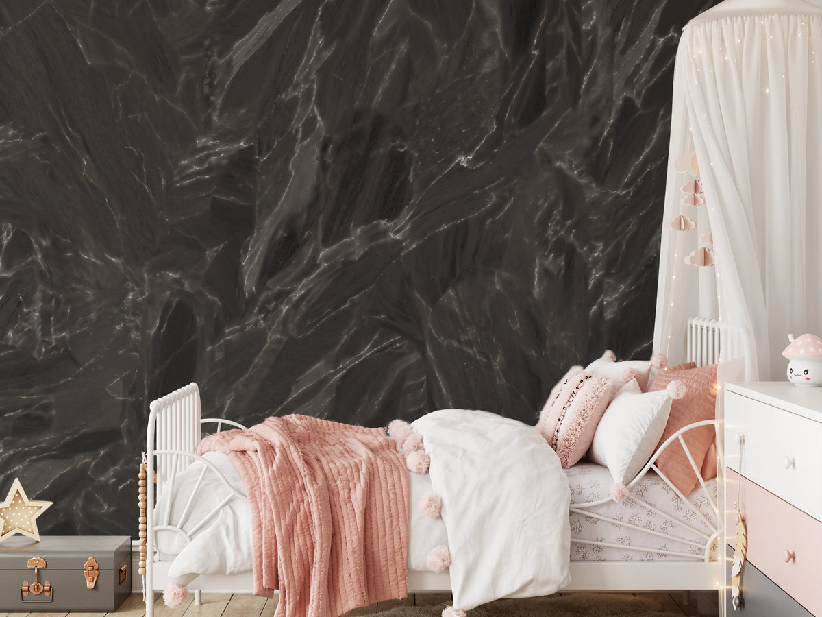 Near-black marble-look stone mural with fine white veining in bedroom