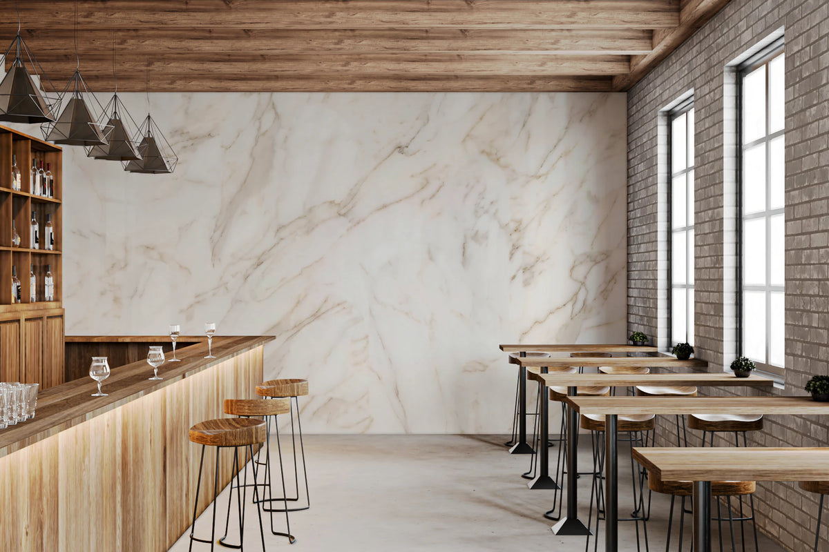 Cream-white marble stone mural with warm branching veins