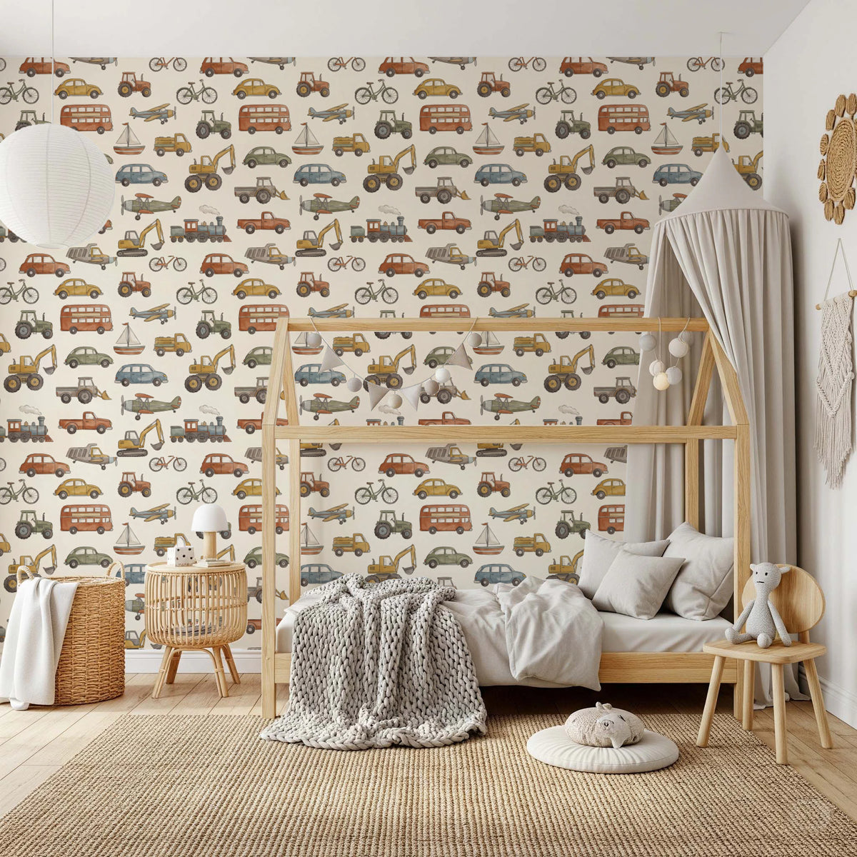 watercolor cars, planes, boats, and trains on cream wallpaper in kids room