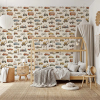 watercolor cars, planes, boats, and trains on cream wallpaper in kids room