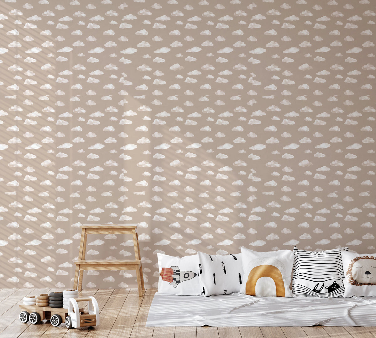 Beige wallpaper with simple white clouds in a soft, dreamy layout on kids room wall