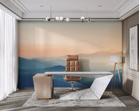Serene sunrise mountain mural with layered peaks
