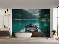 Rustic wooden boat on emerald lake
