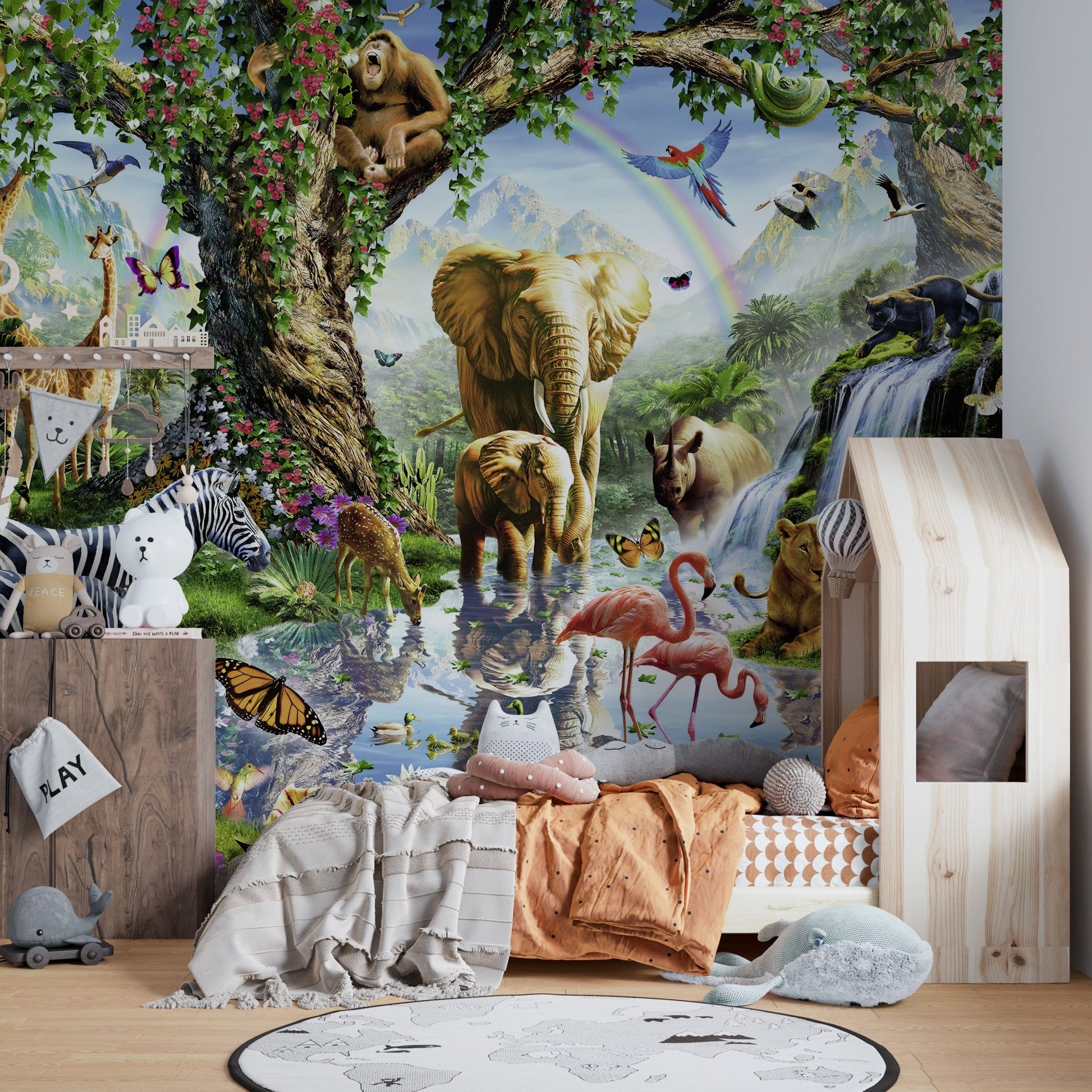 Full wall mural of jungle wildlife in a room with a house-shaped bed.