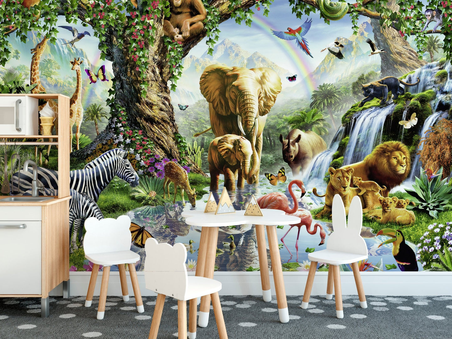 Wildlife animal wall mural behind a white children's table and chairs set.