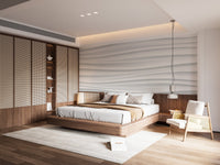 White marble wave wall mural behind a bed in a calm modern bedroom interior