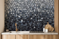 Modern triangle pattern in blue wallpaper.
