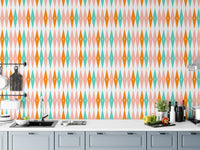 Kitchen backsplash area featuring colorful geometric bundle wall mural and grey cabinets.