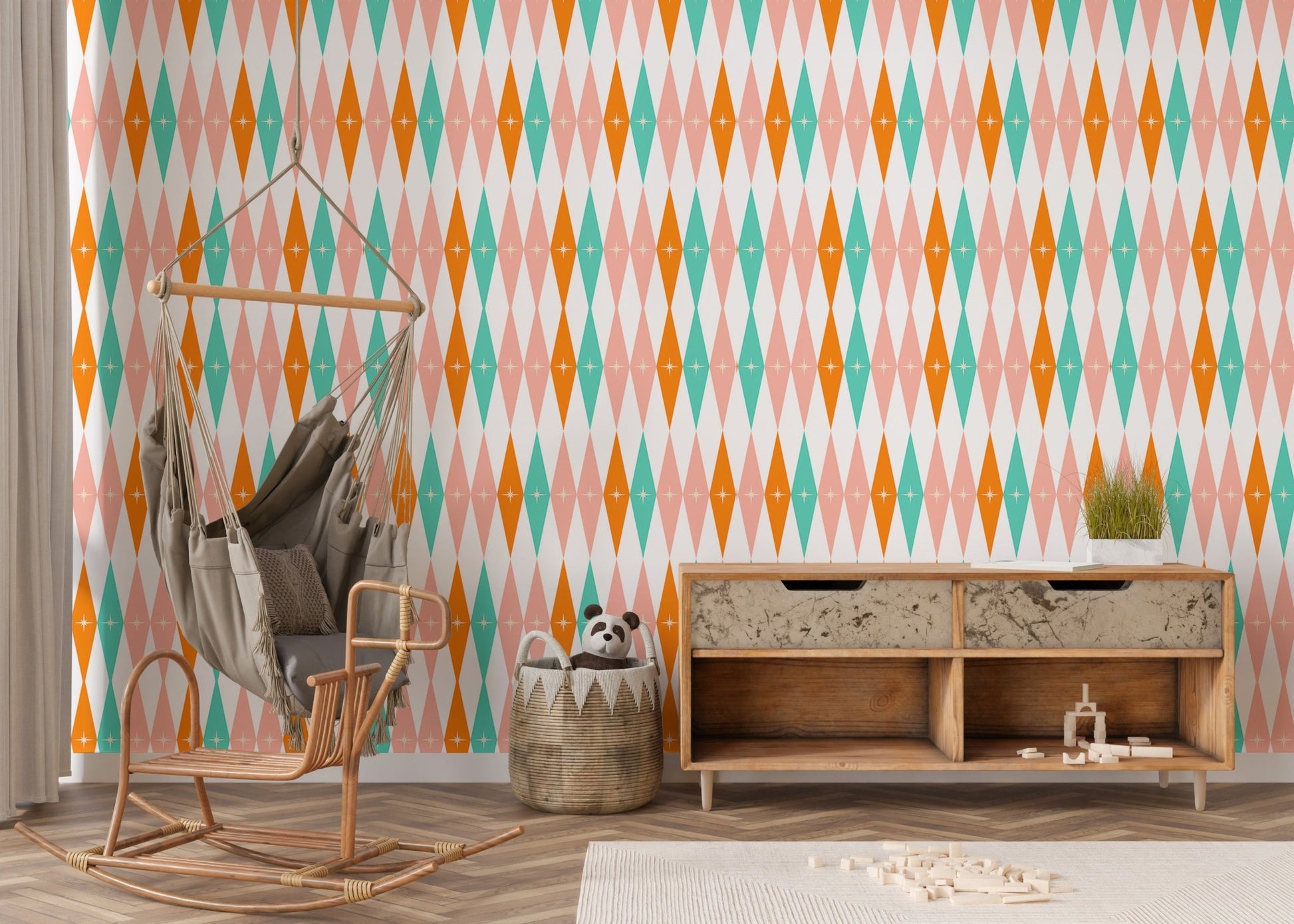 Retro wall mural with teal and orange diamonds in a lounge with a hanging chair.