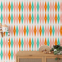 Living area corner with wooden sideboard against a diamond design wall mural.