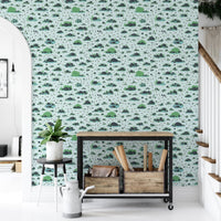 Unique wallpaper design with footprints and lush bushes
