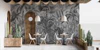 Tropical forest wallpaper mural in soft smokey grey hues