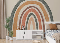 Whimsical rainbow mural with boho charm for nursery walls.
