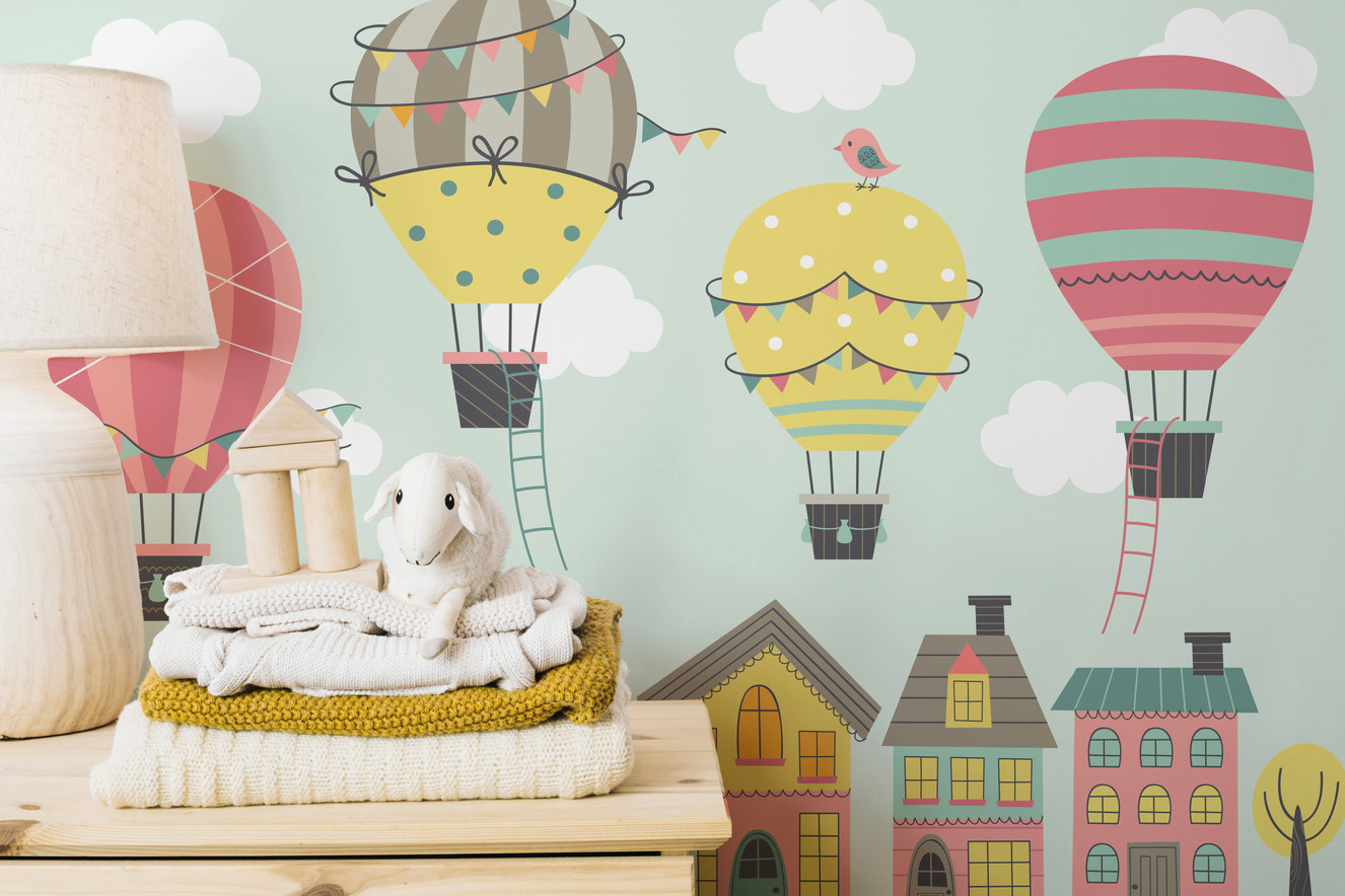 Whimsical balloon mural for imaginative nursery wall decor.
