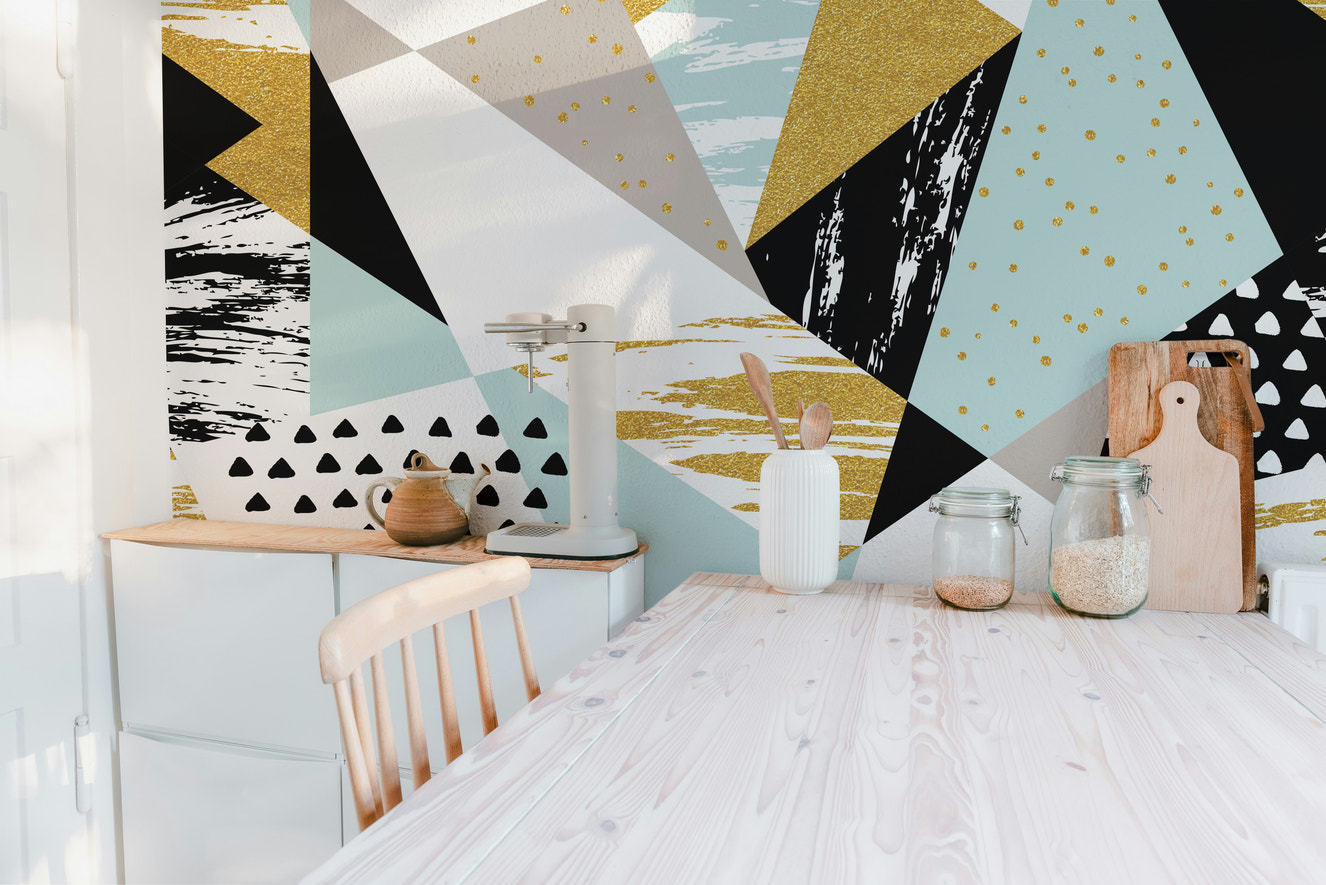 Vibrant abstract triangle infusion mural with geometric charm.