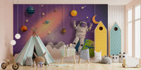 Outer space mural with astronauts, stars, and galaxies for walls.
