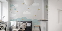 Dreamy mural with crescent moon and clouds for tranquil decor.
