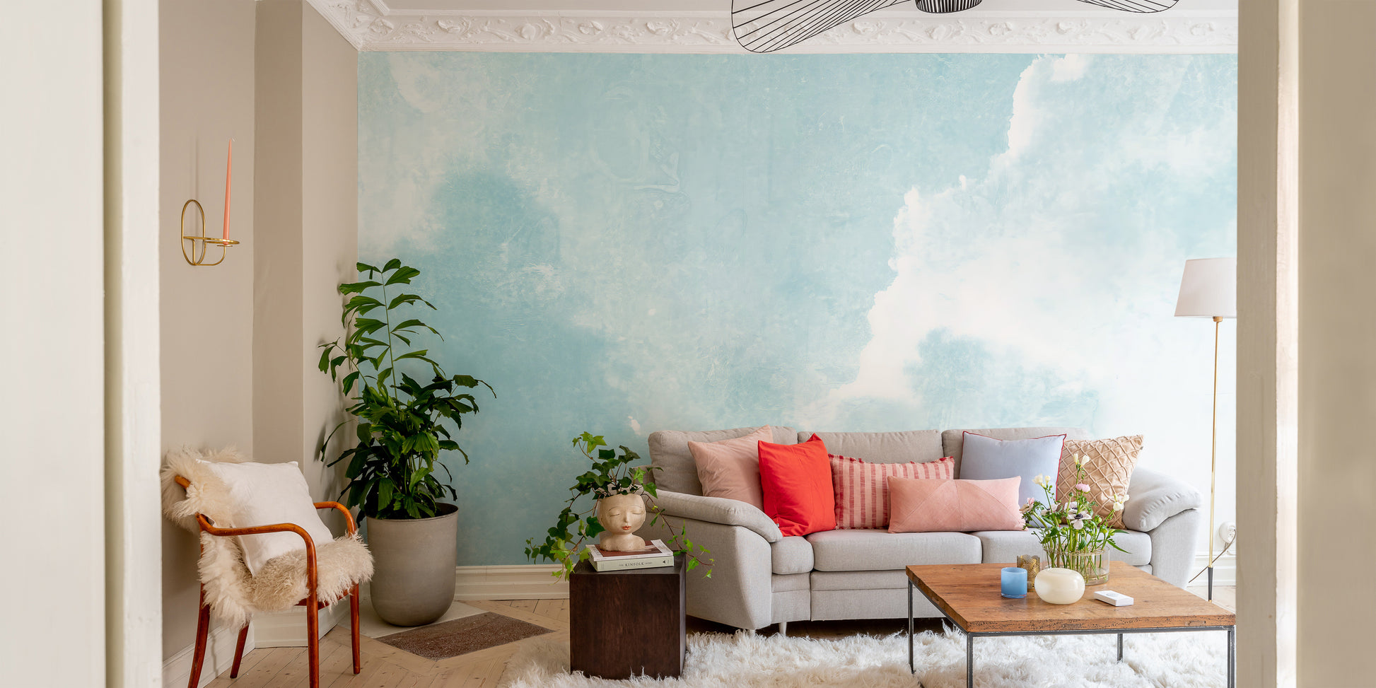 Peaceful mural with blue clouds for tranquil interior spaces.
