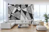 Artistic mural featuring geometric black and white patterns.
