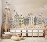 Artistic mural showcasing watercolor European houses, birds, and soft pastel skies.