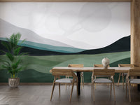 Abstract green hills with planets orbiting overhead in the light sky.