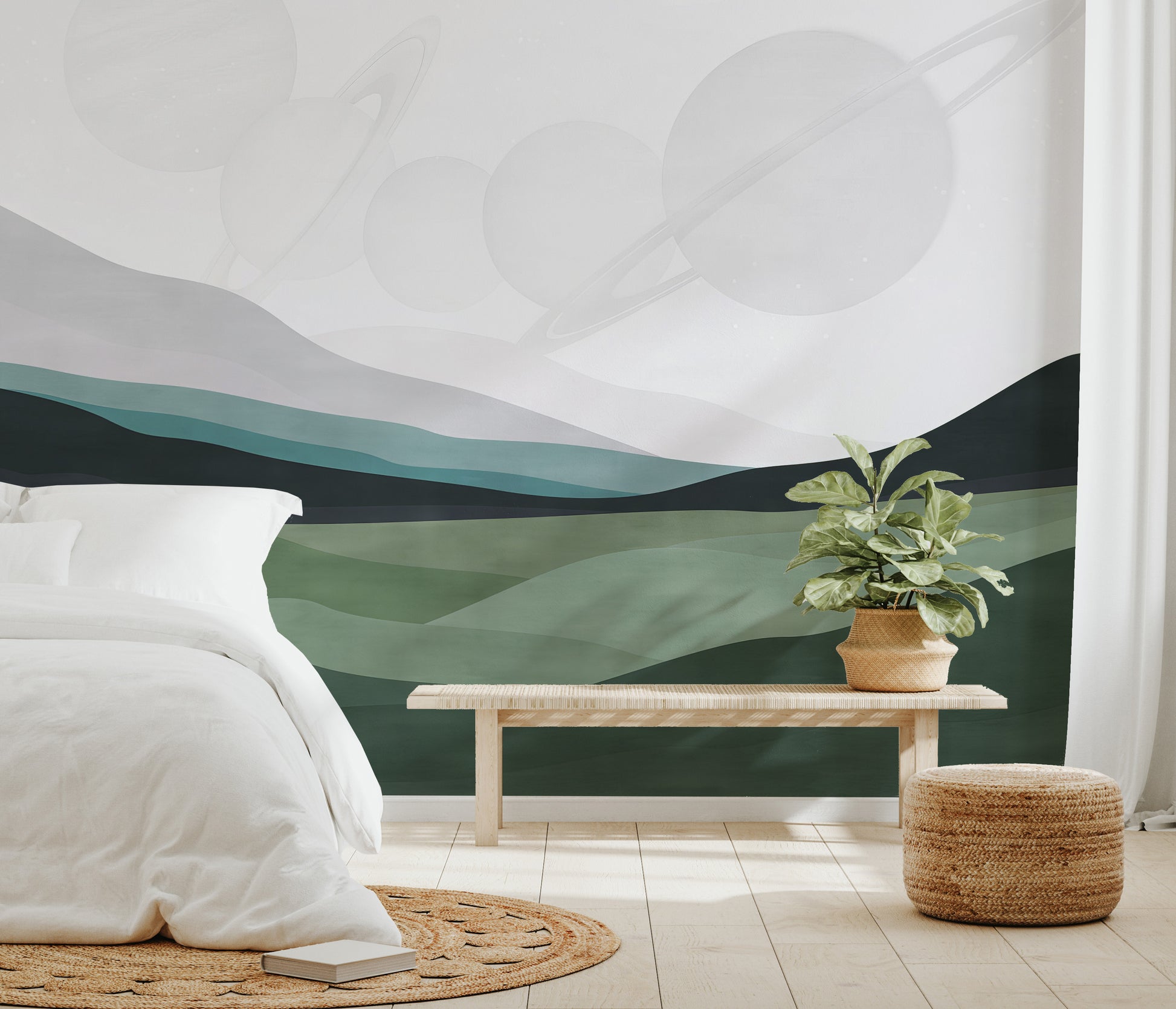 Tranquil landscape of watercolor hills with planets floating in a pale sky.