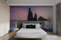 Peaceful beach scenery with misty waves and rocks
