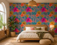 Teal palm leaves and bright hibiscus blooms on tropical wallpaper