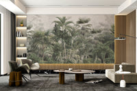 Misty tropical forest wall mural with lush leaves
