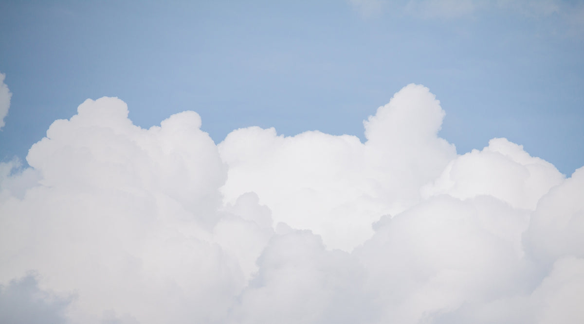 Serene Azure Sky with Clouds Wallpaper Mural in your room — zoomed