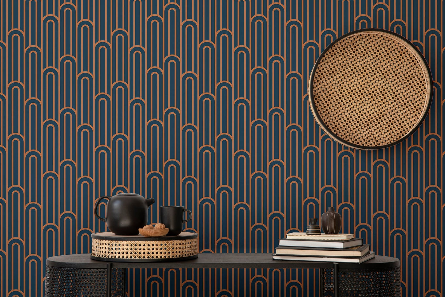 Dark navy wallpaper with orange lines behind a black console table.